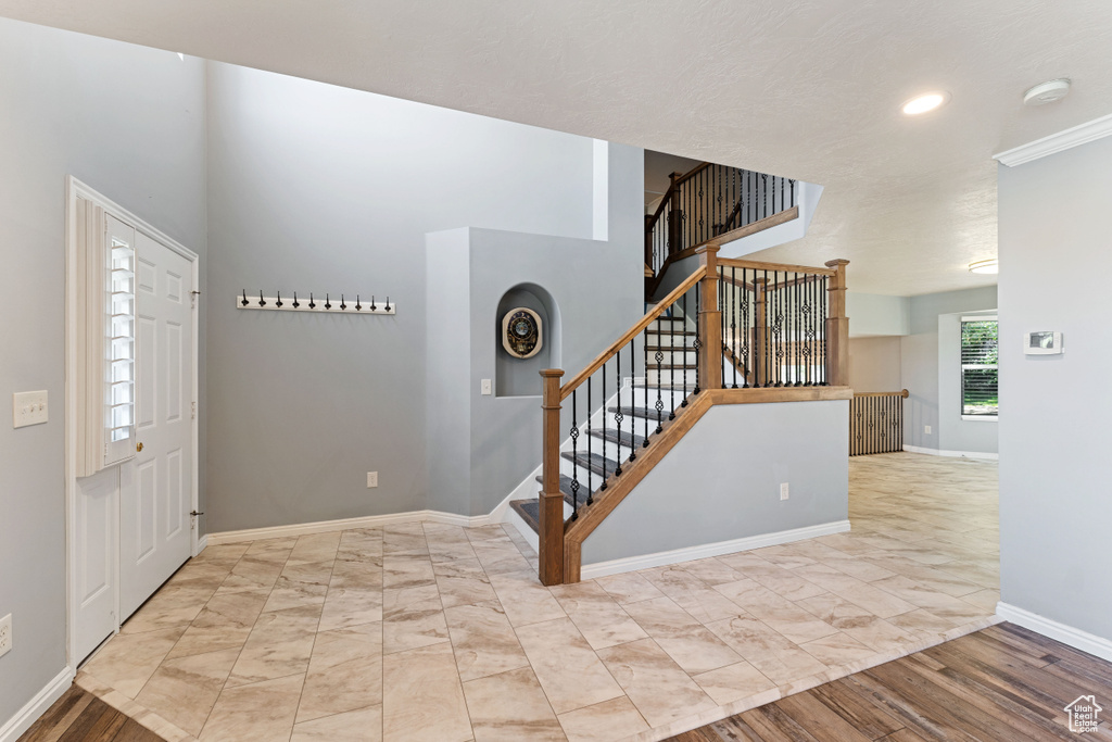 Entrance foyer featuring light wood-type flooring