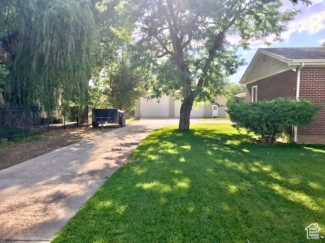 View of yard featuring a garage