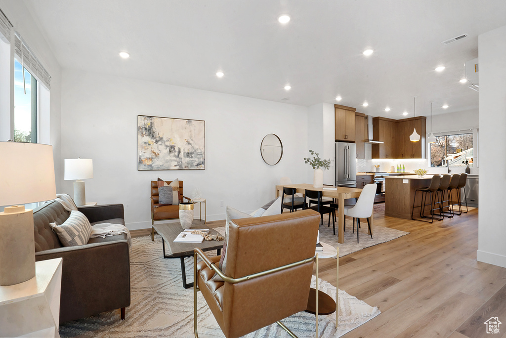 Living room with light hardwood / wood-style floors