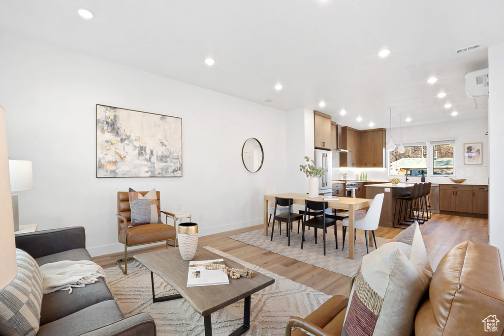 Living room with light wood-type flooring