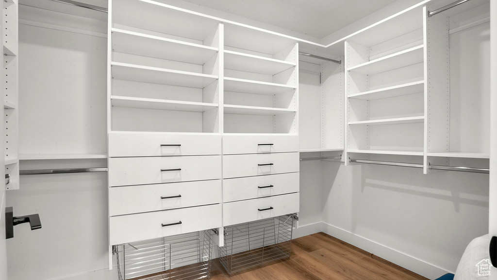 Walk in closet featuring wood-type flooring