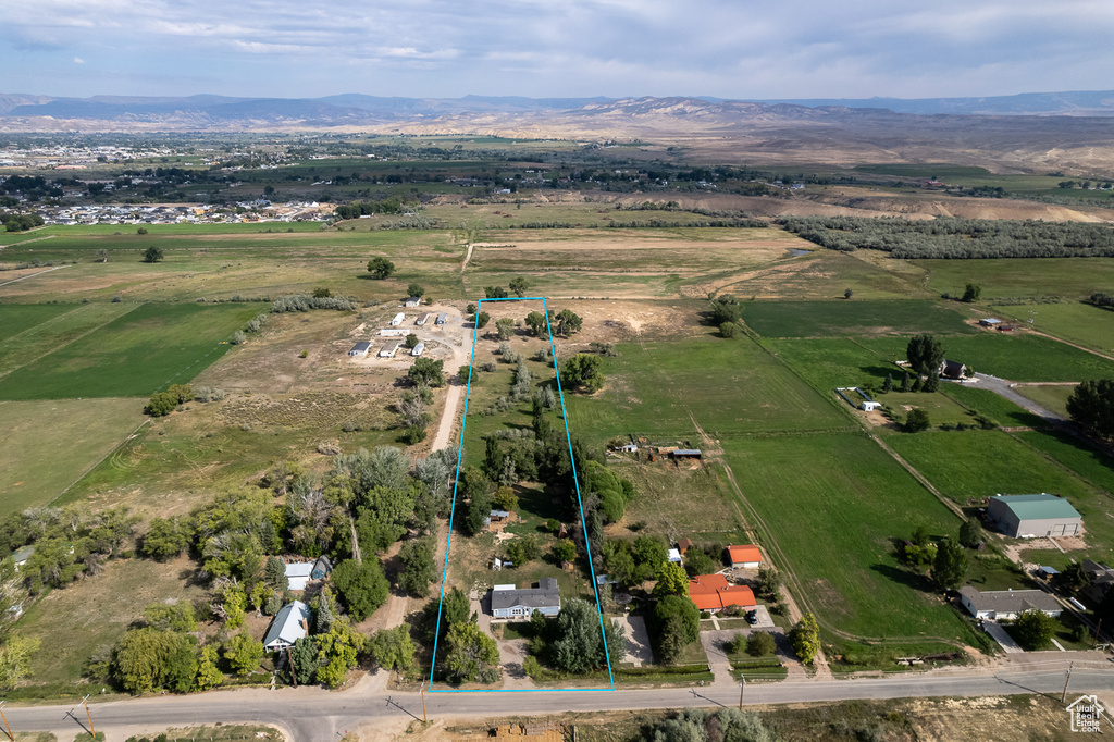 Birds eye view of property featuring a mountain view and a rural view