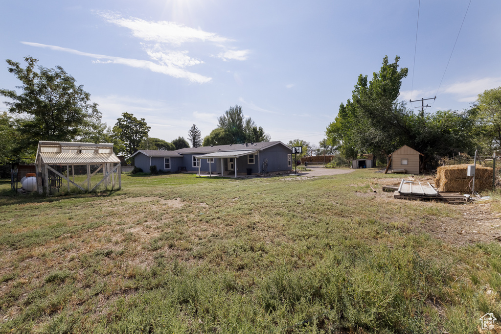 View of yard with a shed