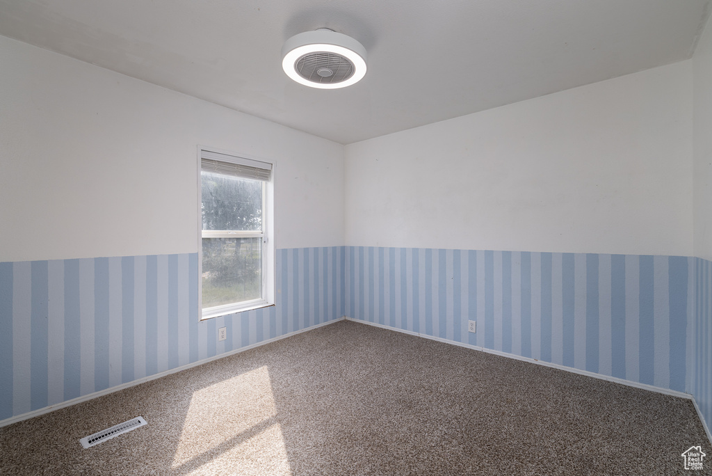 Unfurnished room featuring carpet flooring