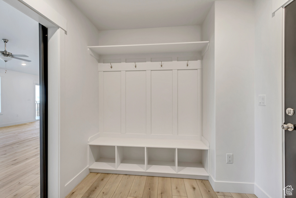 Mudroom featuring ceiling fan and light wood-type flooring