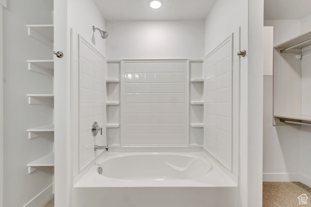 Bathroom with shower / bathing tub combination