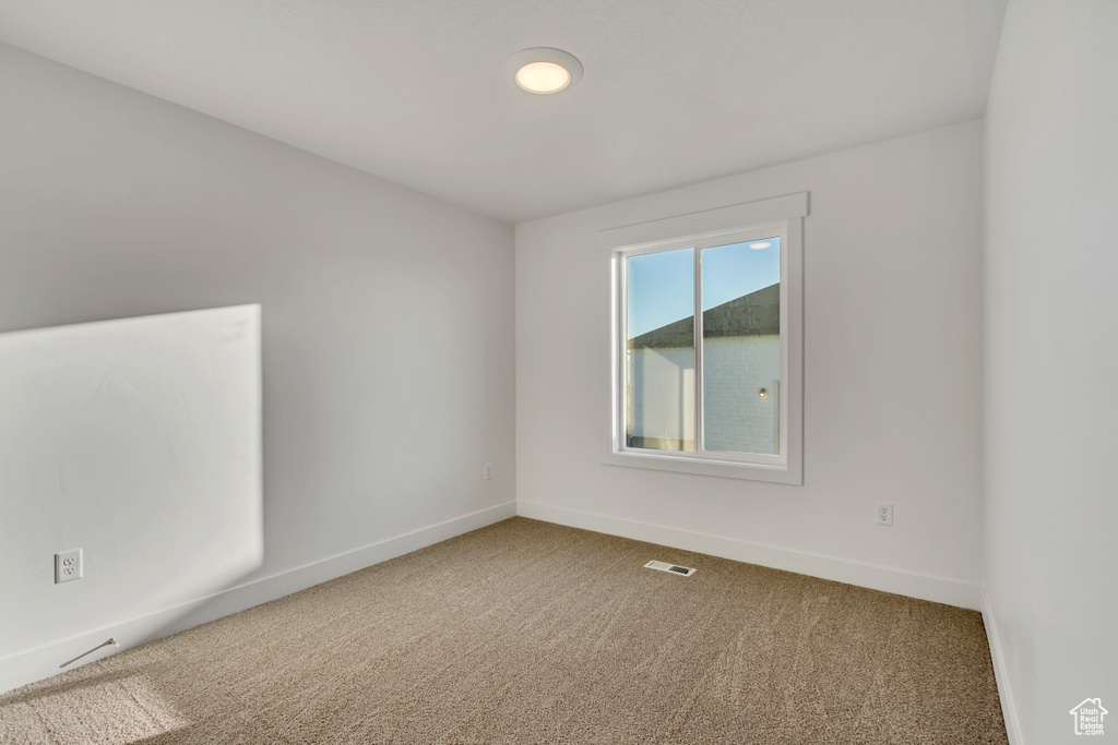 Unfurnished room featuring carpet floors