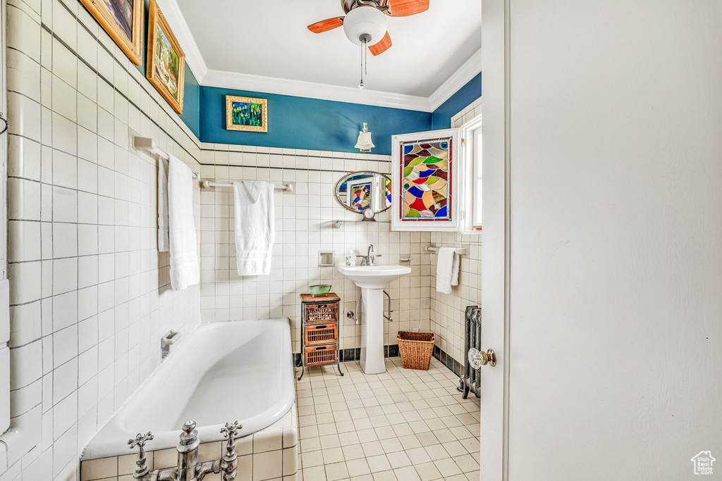 Bathroom featuring tile walls, ceiling fan, ornamental molding, and tile patterned flooring