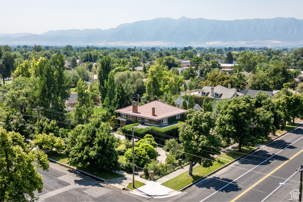 Birds eye view of property with a mountain view