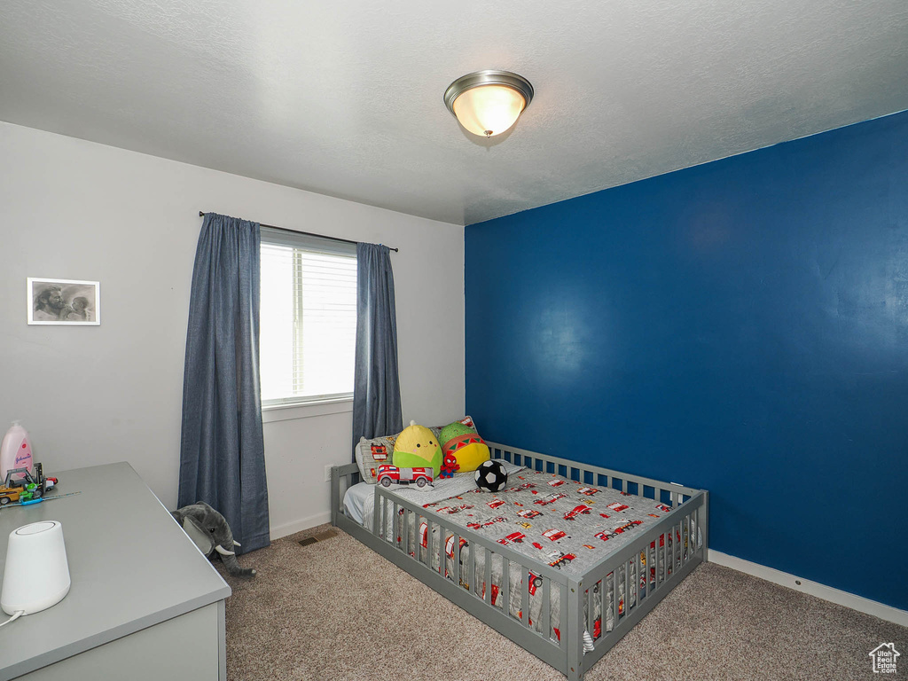 View of carpeted bedroom