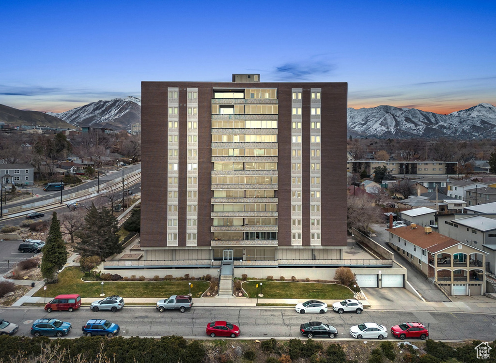 Outdoor building at dusk with a mountain view