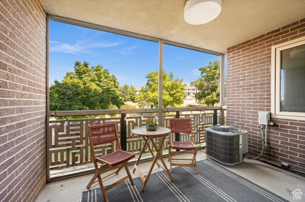 Balcony featuring central AC unit