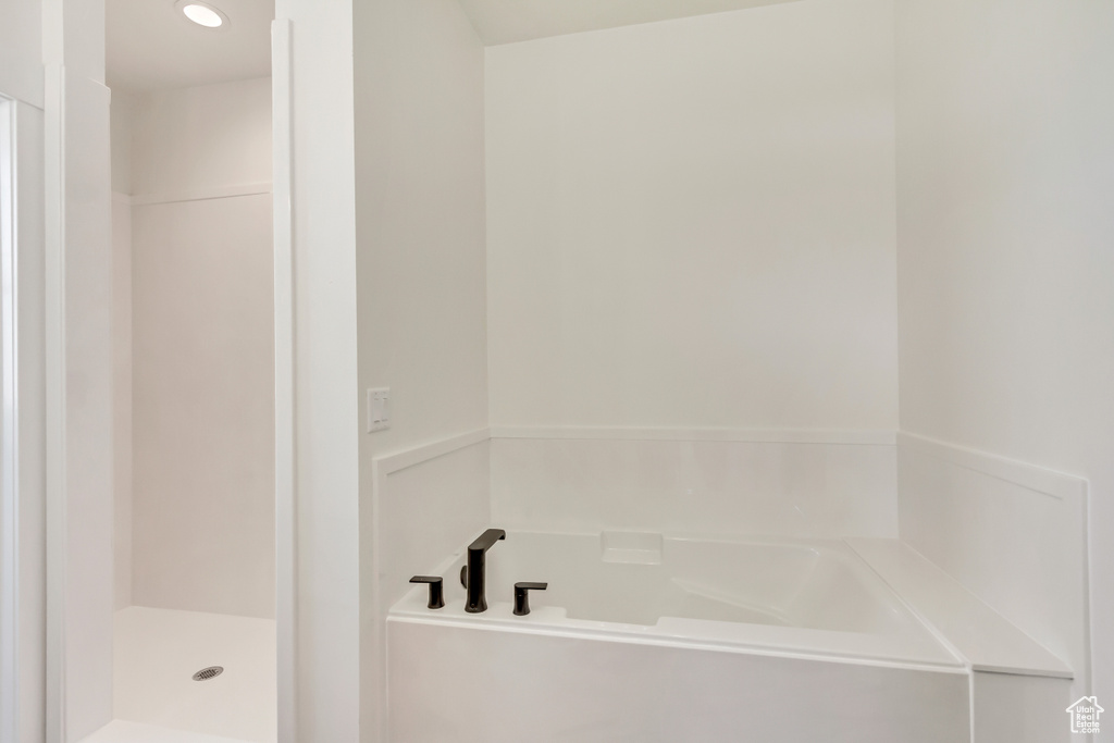 Bathroom with shower with separate bathtub