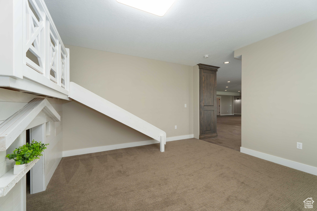Interior space featuring dark carpet