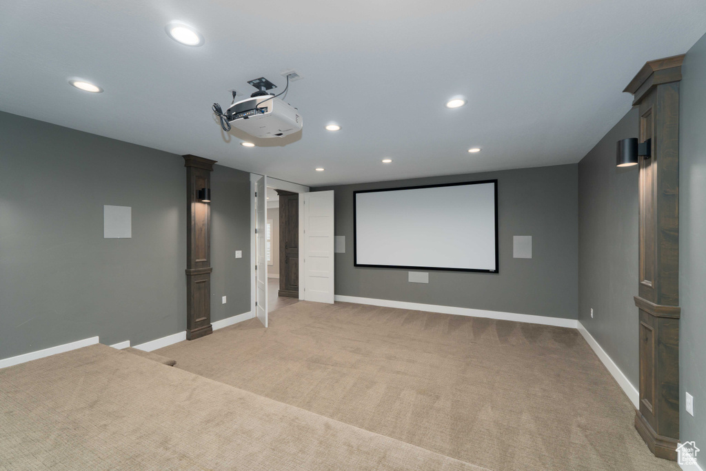 Home theater room with light carpet