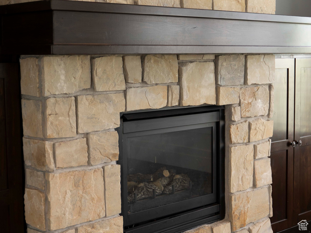 Interior details featuring a fireplace and carpet