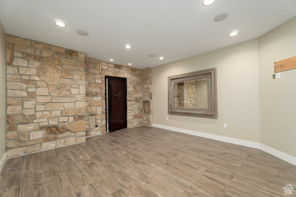 Unfurnished living room featuring wood-type flooring