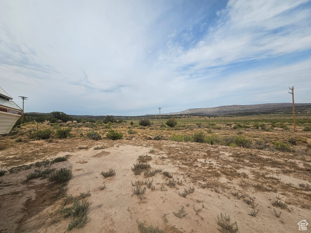 View of yard with a rural view