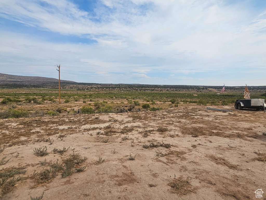 View of yard with a rural view