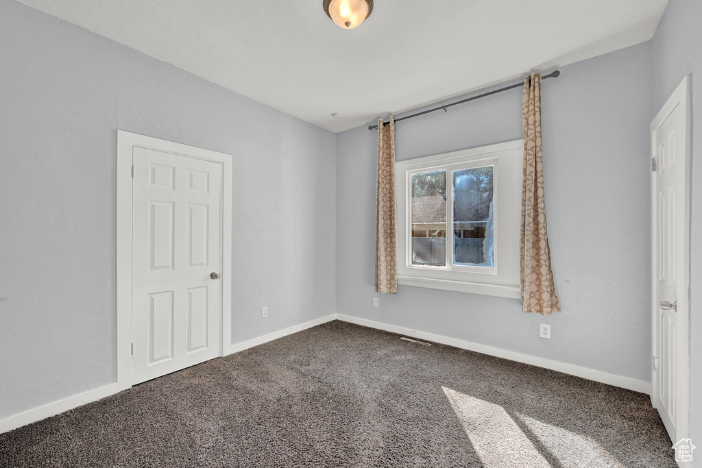 View of carpeted spare room