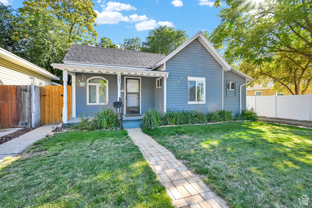 View of front of property with a front yard