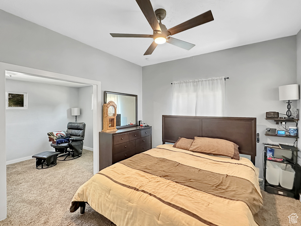 Bedroom with light carpet and ceiling fan