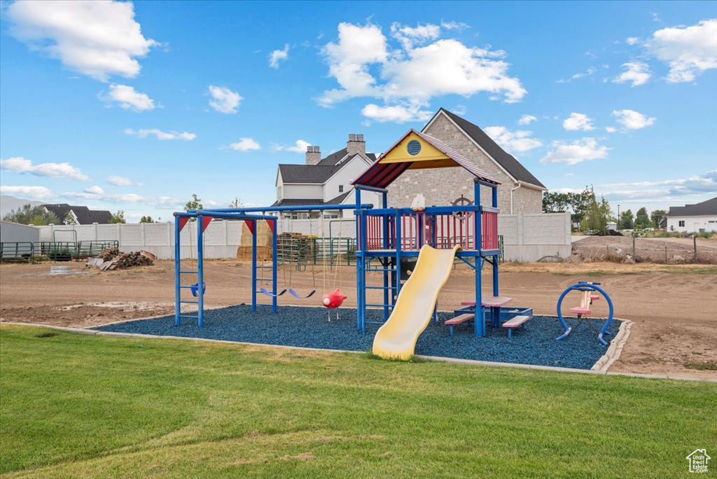 View of play area with a lawn