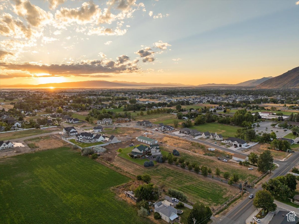 Aerial view at dusk featuring a mountain view