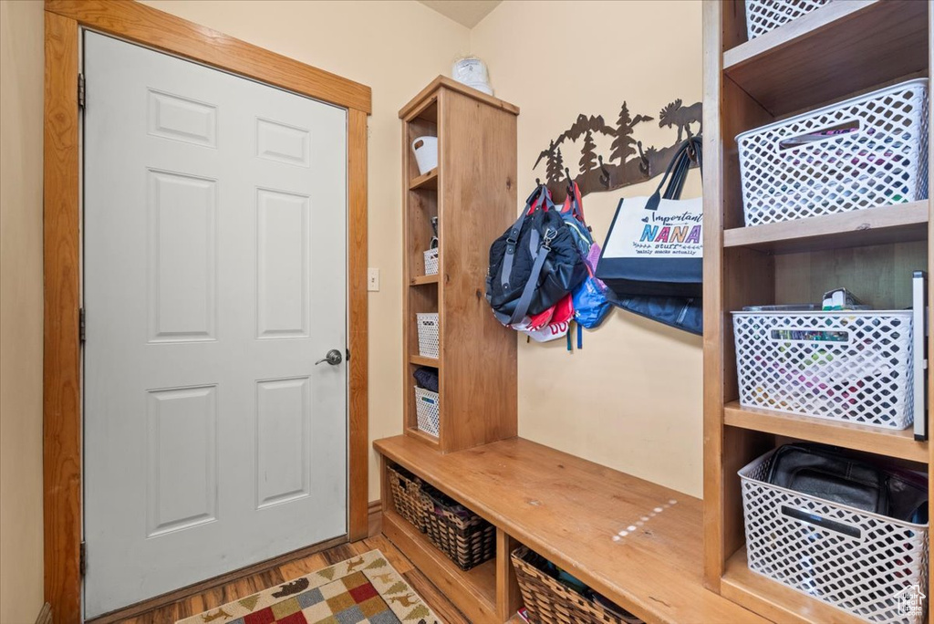 Mudroom with light hardwood / wood-style floors