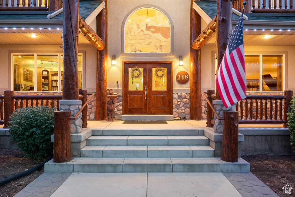 Entrance to property featuring french doors