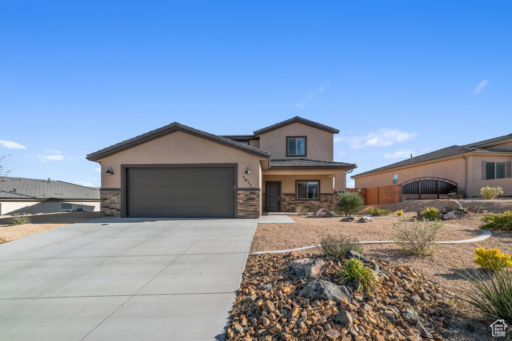 View of front of property with a garage