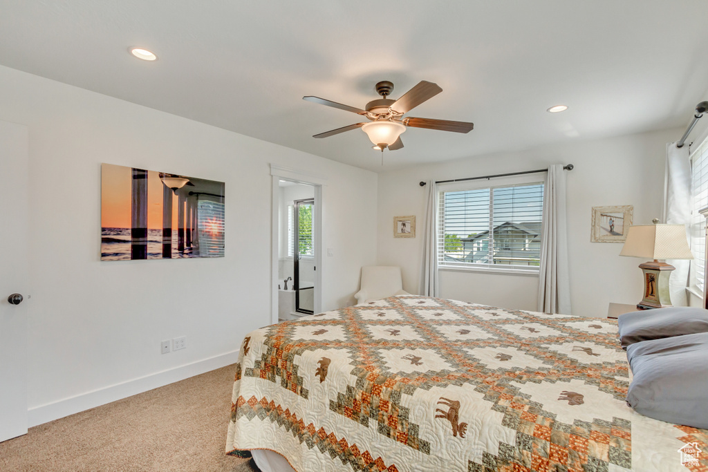 Carpeted bedroom with ceiling fan