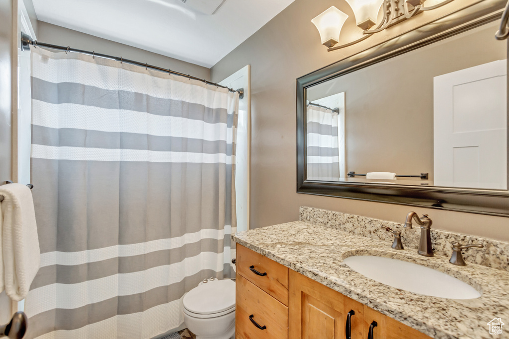 Bathroom with toilet and vanity