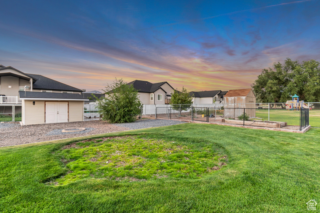 View of front of property featuring a lawn