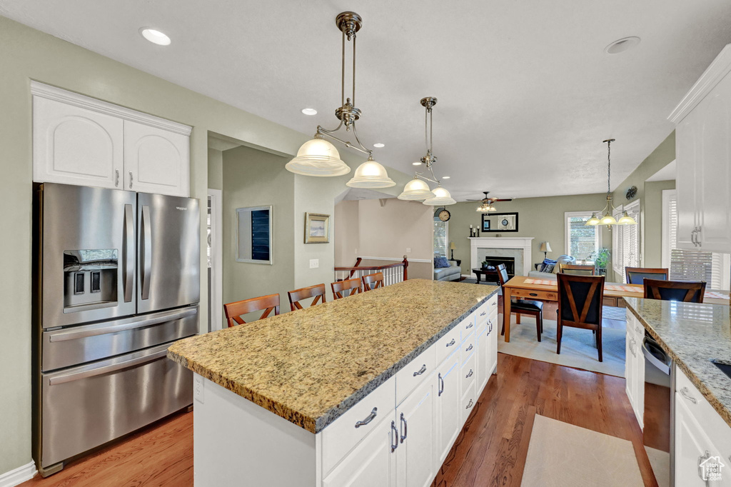 Kitchen featuring white cabinetry and stainless steel appliances