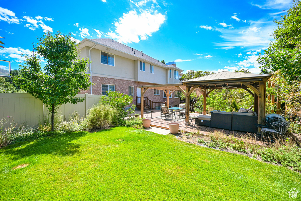 View of yard with outdoor lounge area, a patio area, and a gazebo