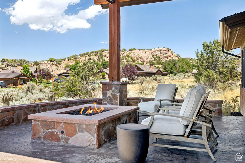 View of patio featuring a fire pit