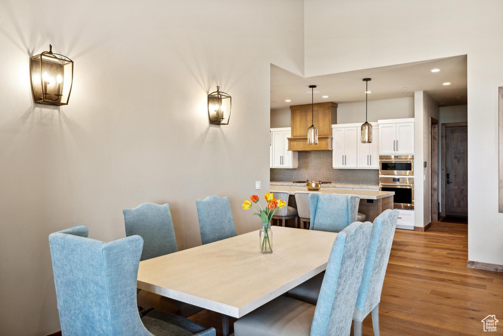 Dining area with hardwood / wood-style flooring