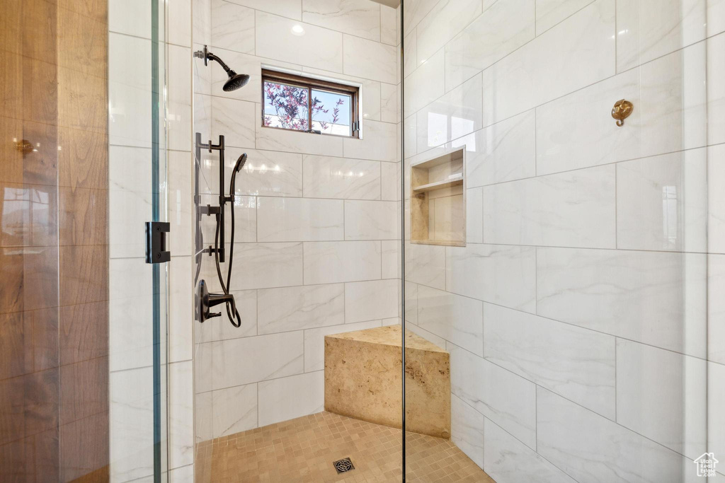 Bathroom with a shower with shower door