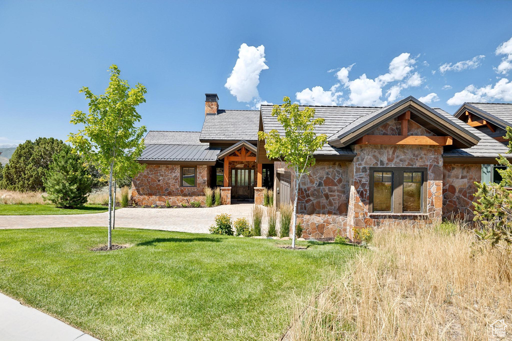 View of front of house featuring a front lawn