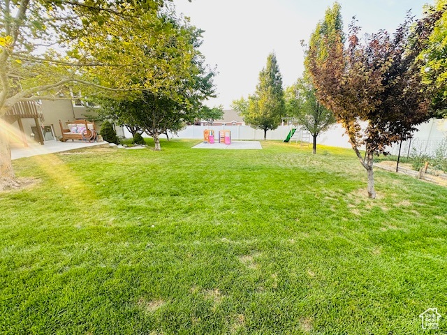 View of yard with a playground