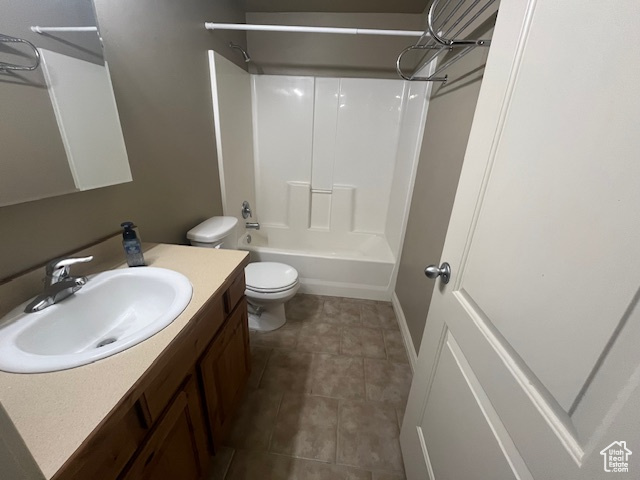 Full bathroom with vanity, toilet, and shower / washtub combination