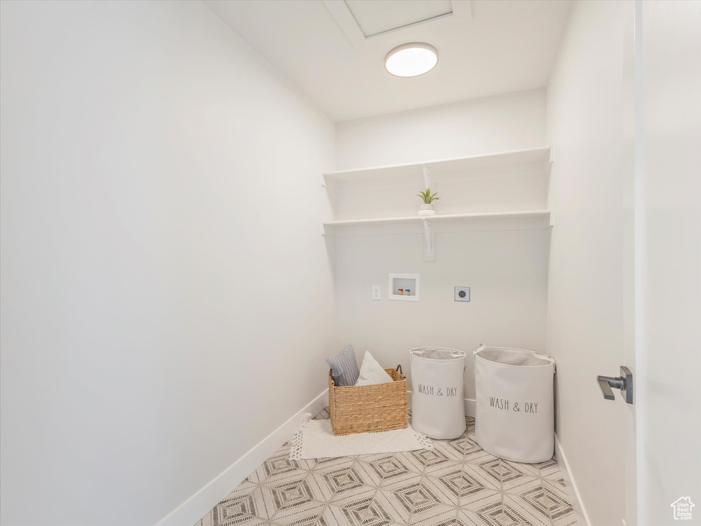 Laundry room with washer hookup and hookup for an electric dryer