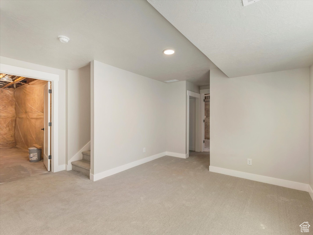 Basement featuring carpet flooring