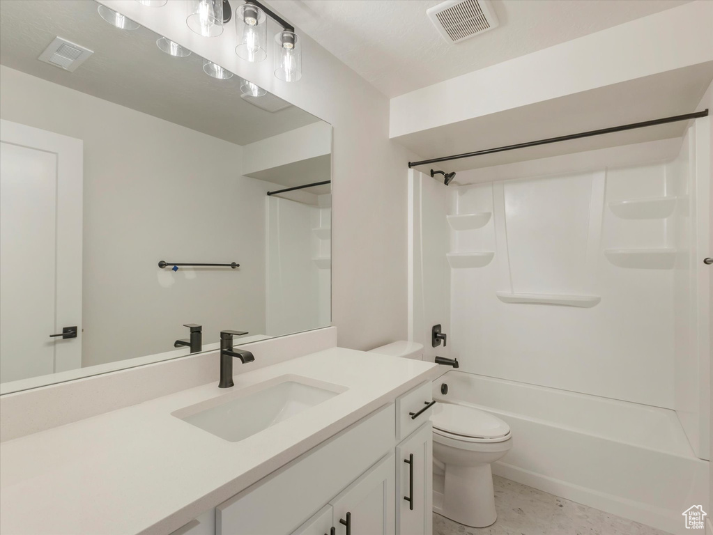 Full bathroom with shower / bathing tub combination, vanity, toilet, and tile patterned flooring