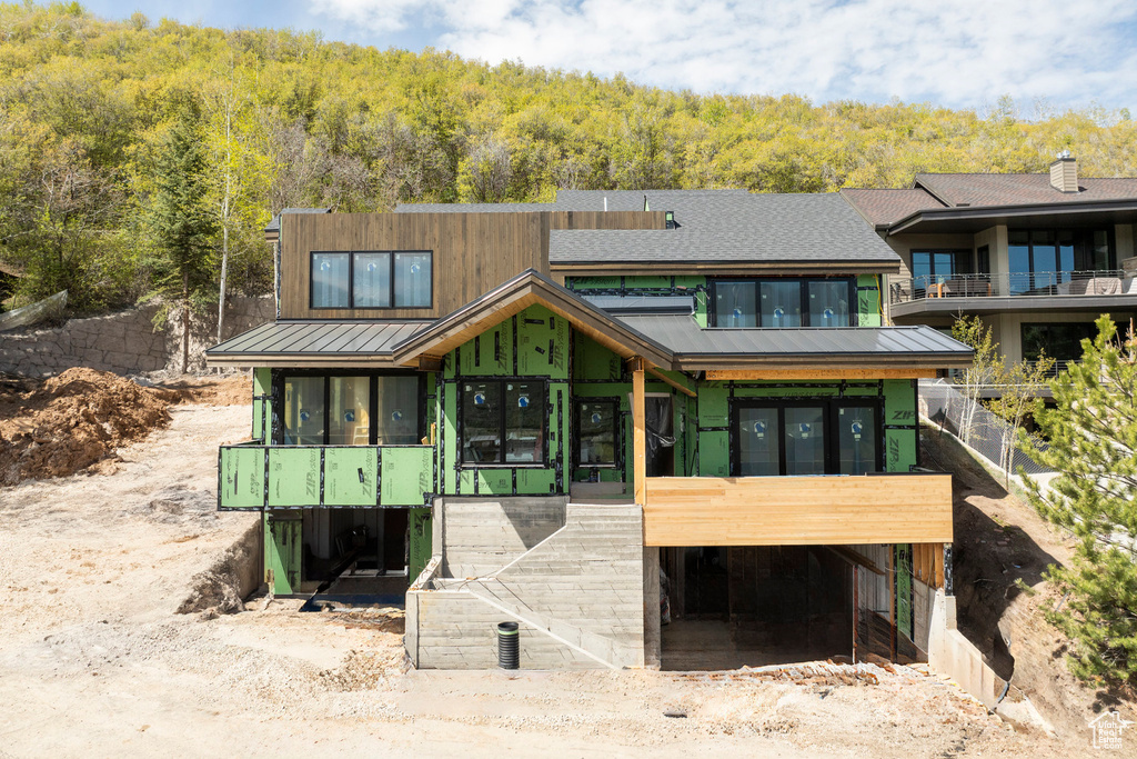 View of front of house with a balcony