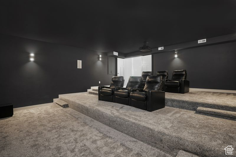 Home theater room featuring carpet flooring