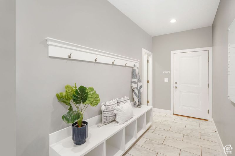 Mudroom featuring light tile patterned flooring