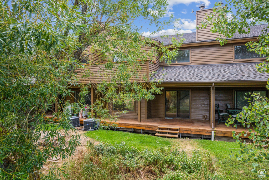 Rear view of house with a wooden deck