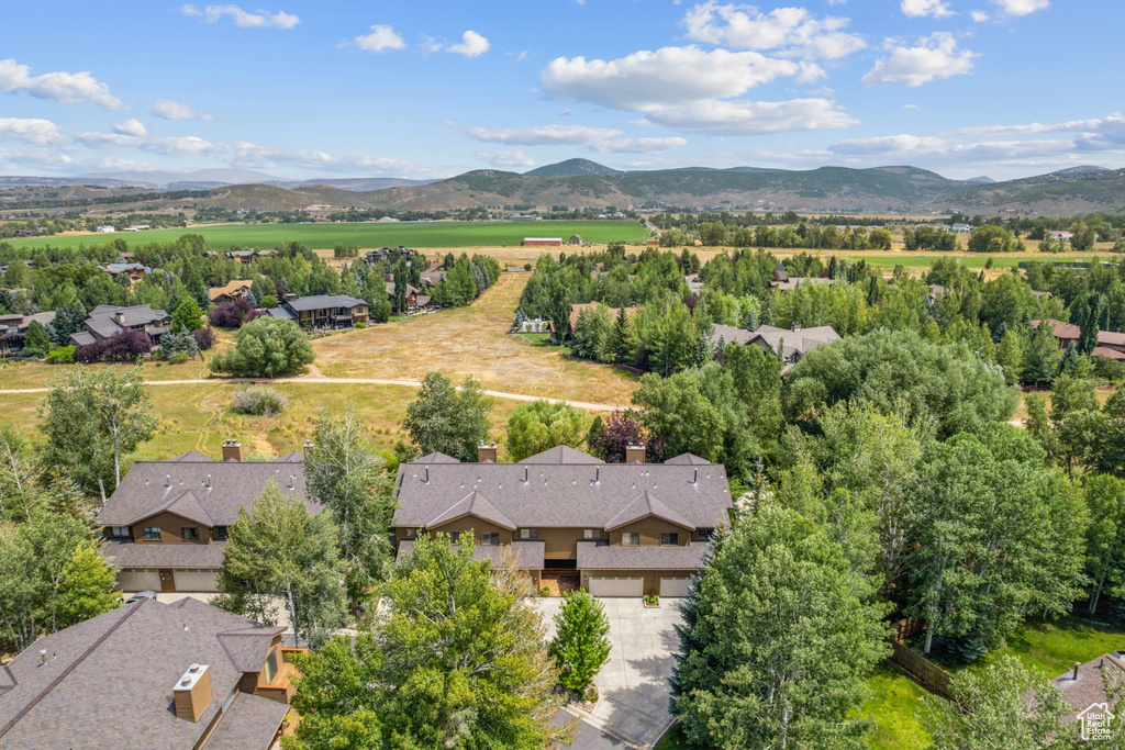 Birds eye view of property with a mountain view